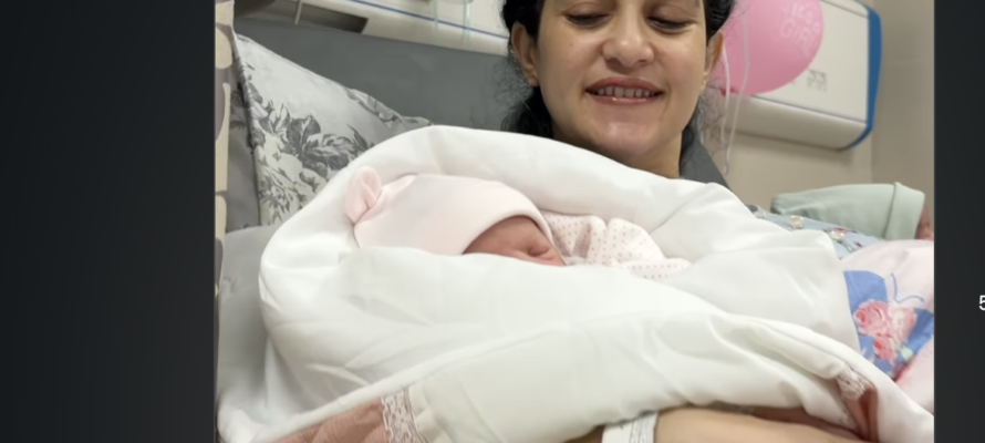 Sanabel Al-Rai, wife of convicted terrorist Basel Al-Asmar, poses with twins.