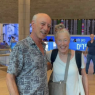 Adriana Turk, 74 reunites with relative Raanan Gidron, 73, both descended from Jews who survived the Holocaust.