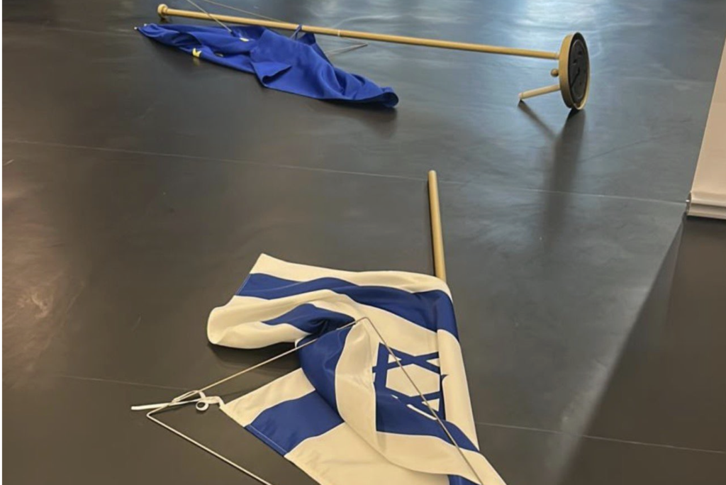 Israeli and EU flags knocked down and EU parliament, October 5, 2026.